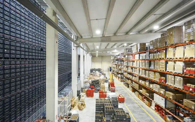A large warehouse with racks of boxes